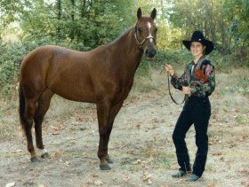 Portrait of cowgirl with her horse.